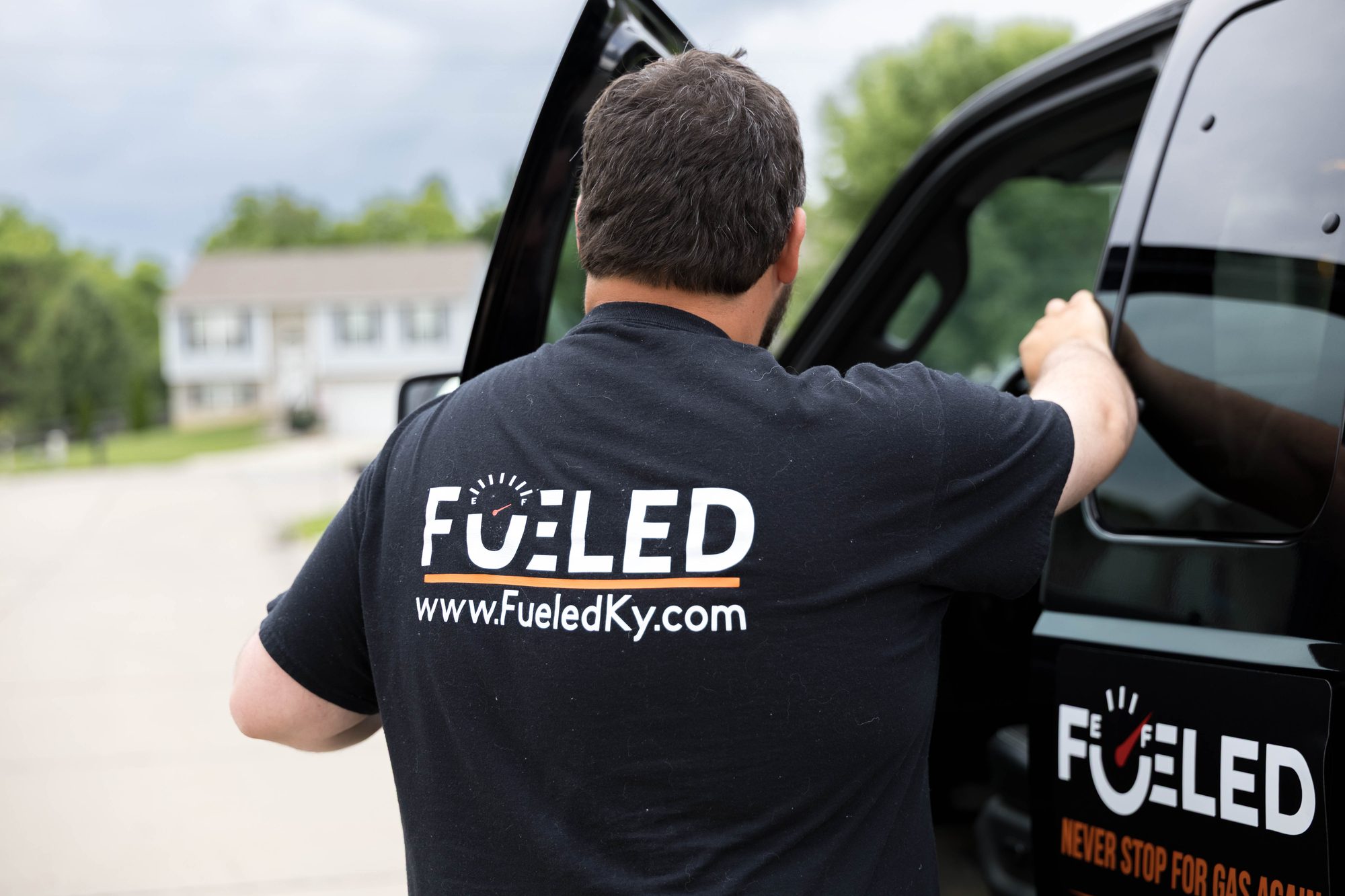 Fueled KY branded gear and van